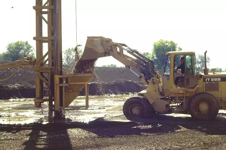 Stones being added into the feeder of a vibro stone column equipment