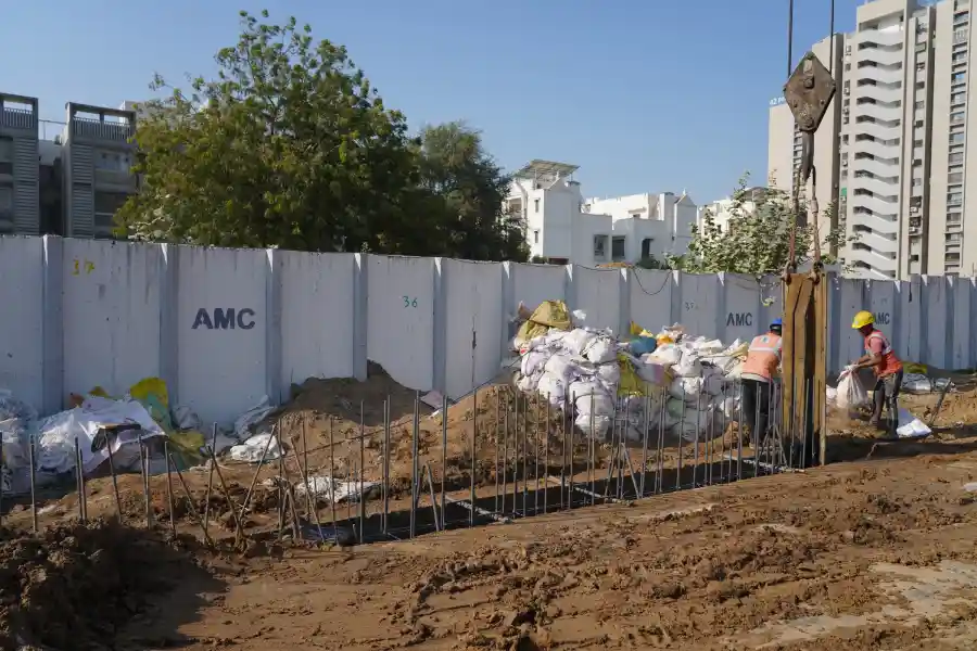 An image of foundations being laid by workers of HIPL