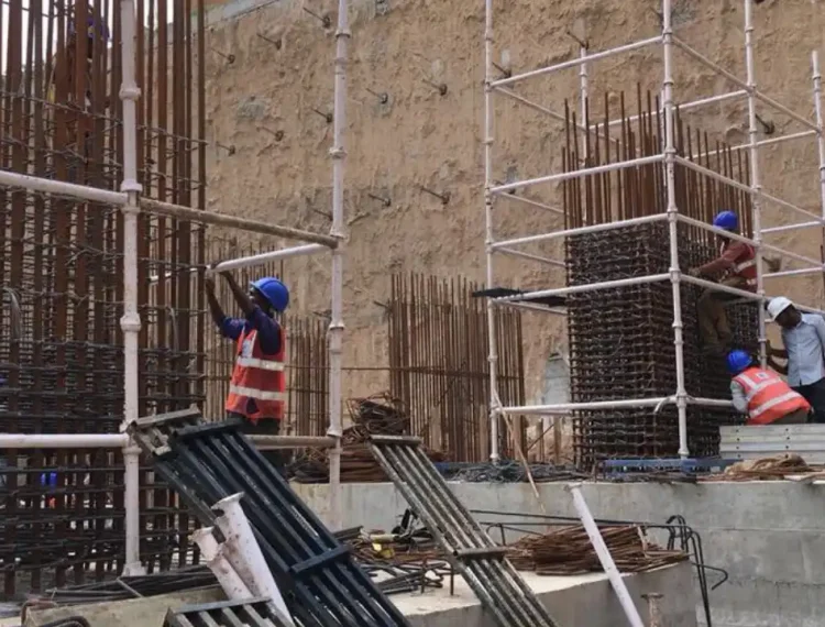 Two construction workers working on a diaphragm wall construction site